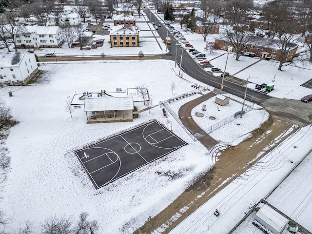 snowy aerial view featuring a residential view