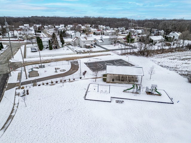 snowy aerial view with a residential view