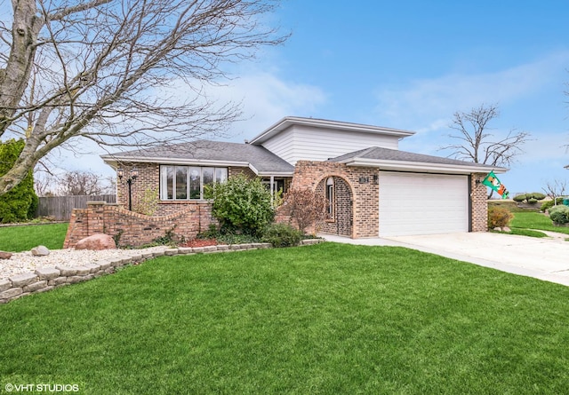 view of front of property with a garage and a front yard