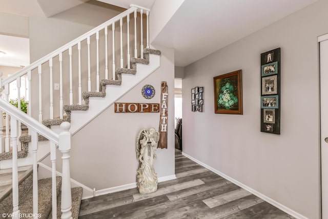 stairway featuring hardwood / wood-style floors