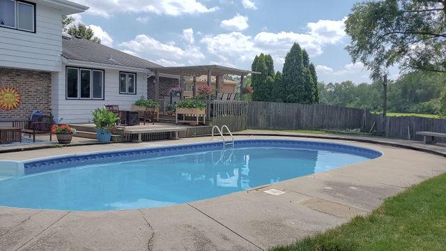 view of pool with a patio and a deck