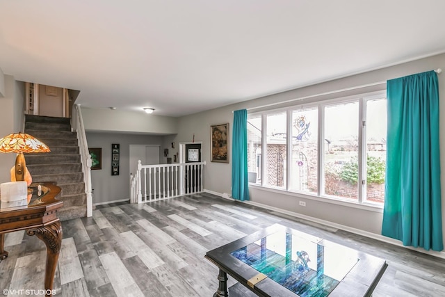 unfurnished living room with wood-type flooring