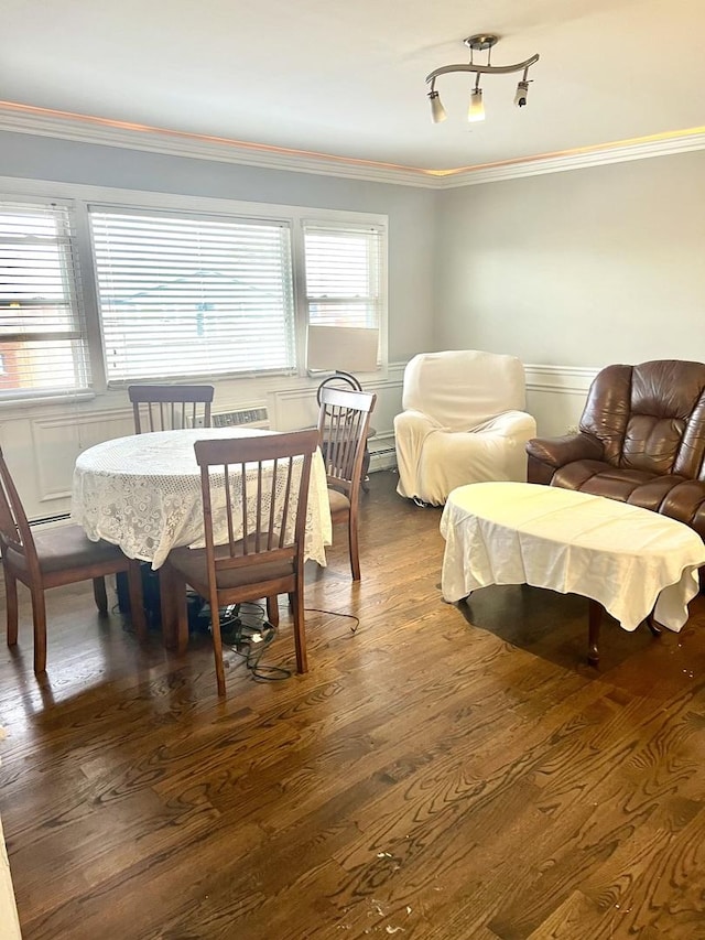 dining room with crown molding and dark wood-type flooring