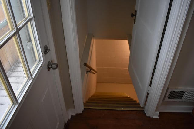 staircase featuring hardwood / wood-style flooring