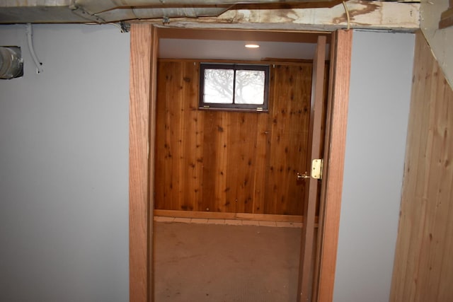 interior space featuring wooden walls