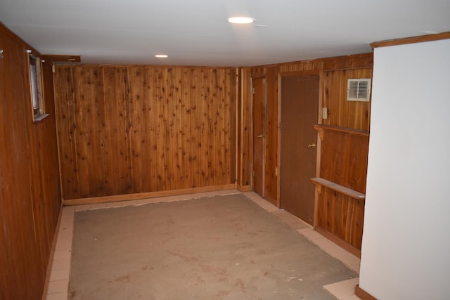 basement with wooden walls