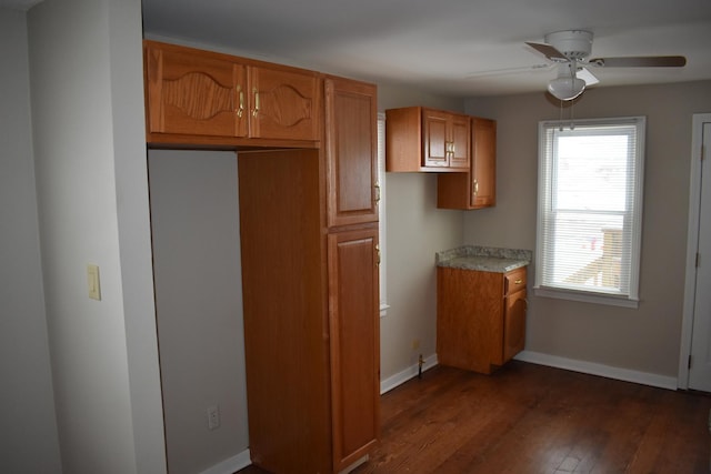 kitchen featuring dark hardwood / wood-style floors and ceiling fan