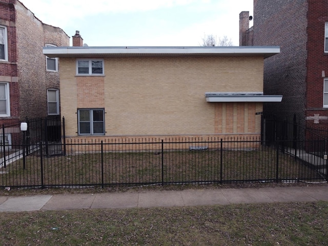 view of side of home with a yard