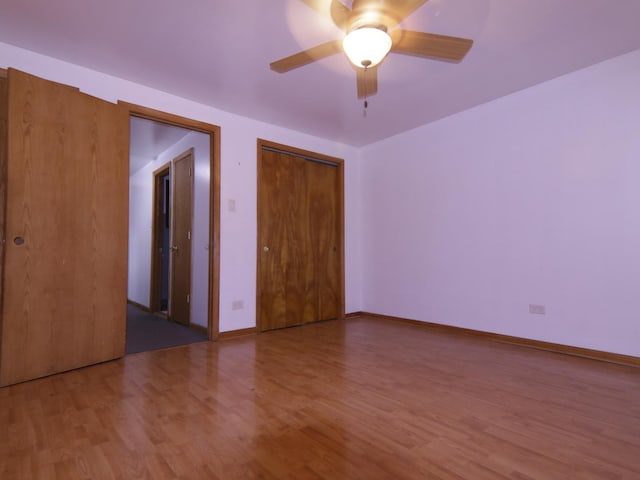 unfurnished room featuring hardwood / wood-style floors and ceiling fan