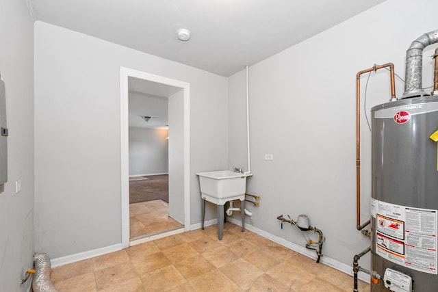 clothes washing area featuring hookup for an electric dryer and water heater