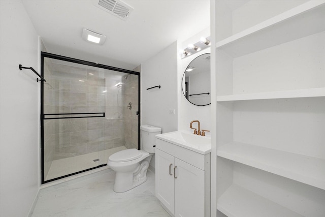 bathroom featuring vanity, toilet, and an enclosed shower