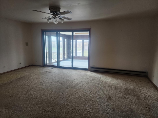 carpeted spare room featuring ceiling fan and a baseboard radiator