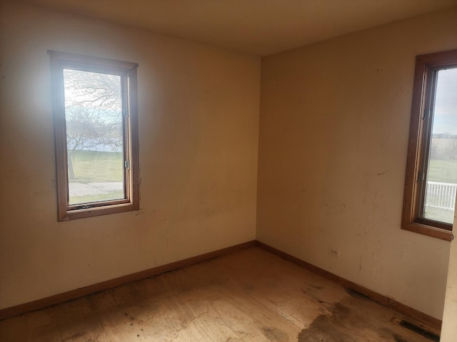 spare room with light wood-type flooring