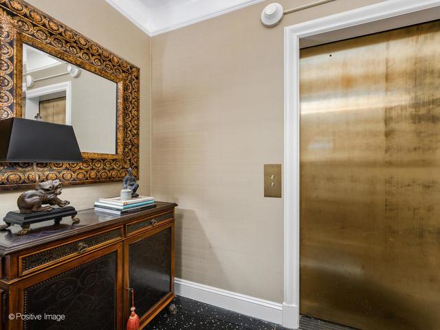 home office with elevator and ornamental molding