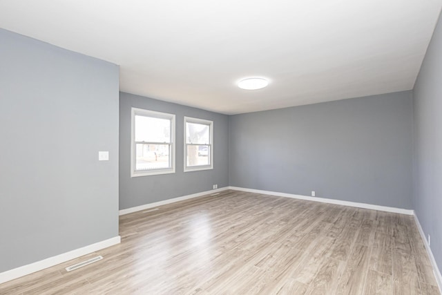 unfurnished room featuring light wood-type flooring