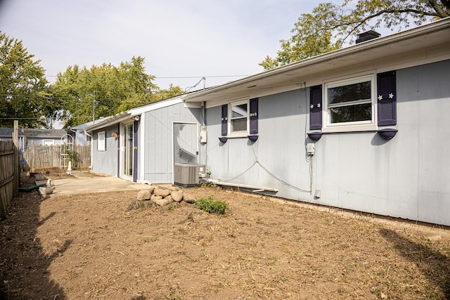 view of side of home with a patio