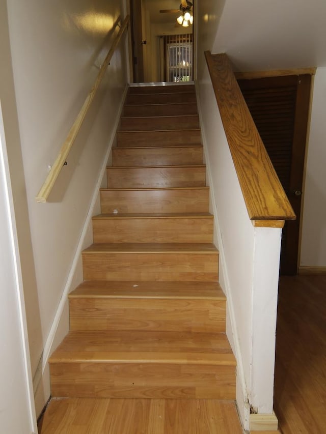 7251 S Ridgeland Ave Unit E, Chicago, IL 60649 - stairway with wood finished floors and ceiling fan