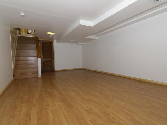 7251 S Ridgeland Ave Unit E, Chicago, IL 60649 - unfurnished room with light wood-style flooring and stairs