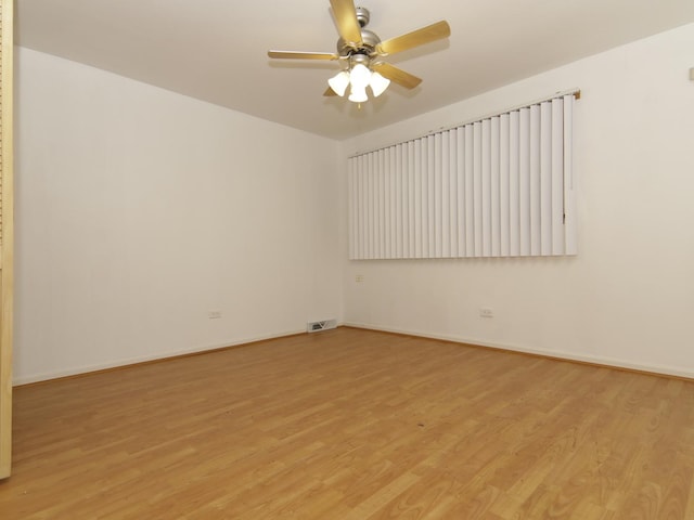 7251 S Ridgeland Ave Unit E, Chicago, IL 60649 - empty room with light wood-type flooring and ceiling fan