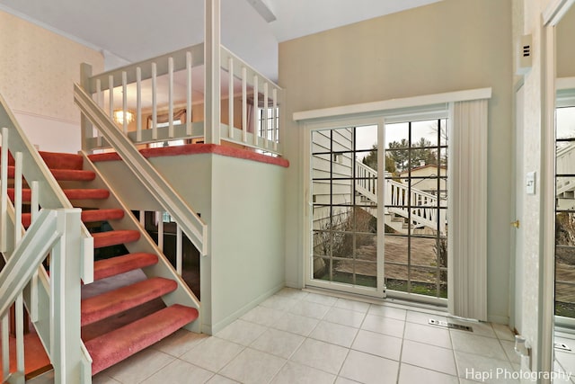 entryway with light tile patterned floors