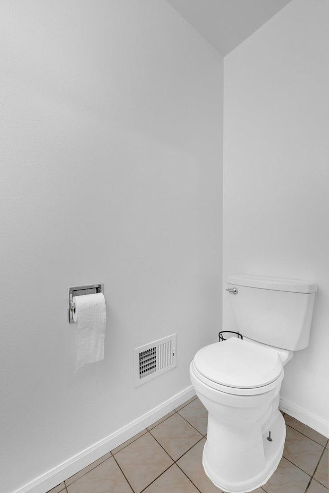 bathroom featuring tile patterned flooring and toilet