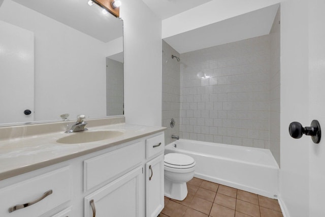 full bathroom featuring tile patterned floors, vanity, toilet, and tiled shower / bath