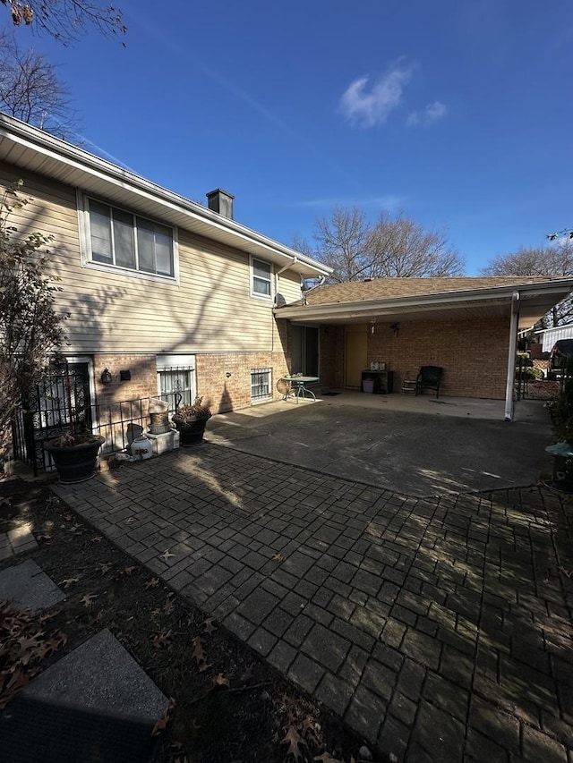 back of house with a patio area