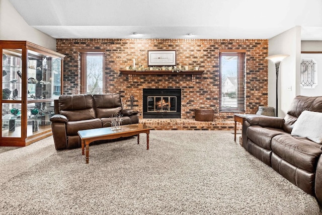 living room with brick wall, carpet, a wealth of natural light, and a fireplace