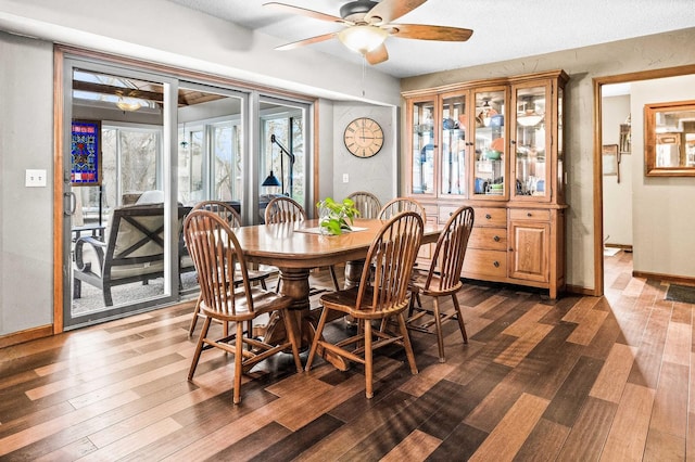 dining space featuring ceiling fan and dark hardwood / wood-style flooring