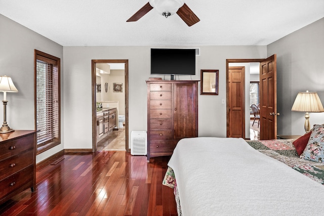 bedroom with dark hardwood / wood-style floors and ceiling fan