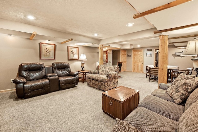 carpeted cinema featuring beam ceiling and a textured ceiling