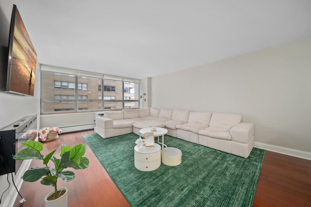 living room featuring dark wood-type flooring and a baseboard radiator