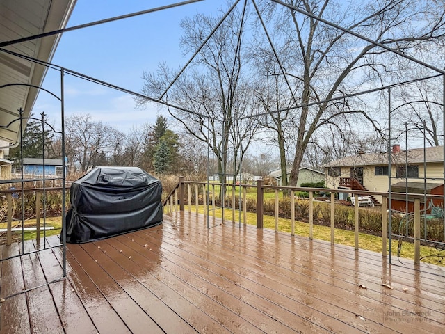 wooden terrace featuring area for grilling