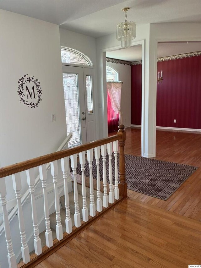 sitting room featuring carpet floors and an inviting chandelier