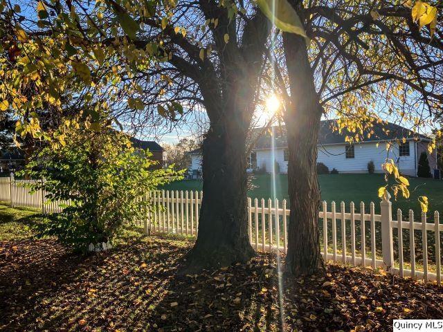 doorway to property featuring a lawn