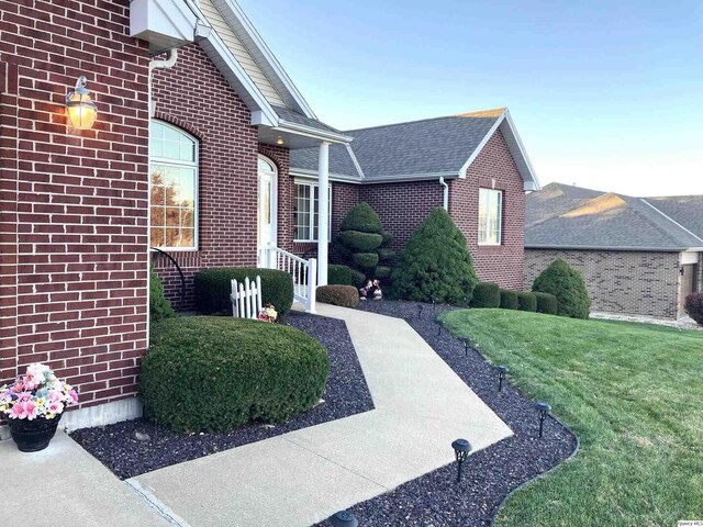 view of front of property with a garage and a front lawn