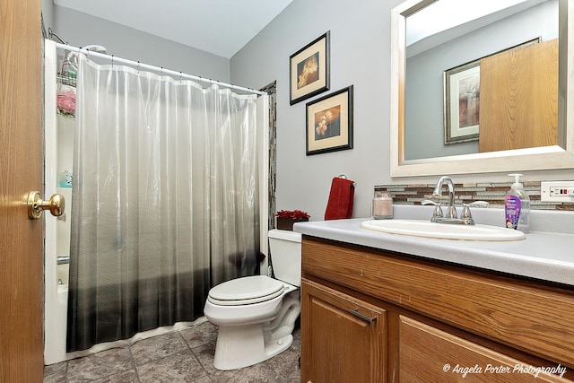 full bathroom featuring tile patterned flooring, shower / tub combo, vanity, and toilet