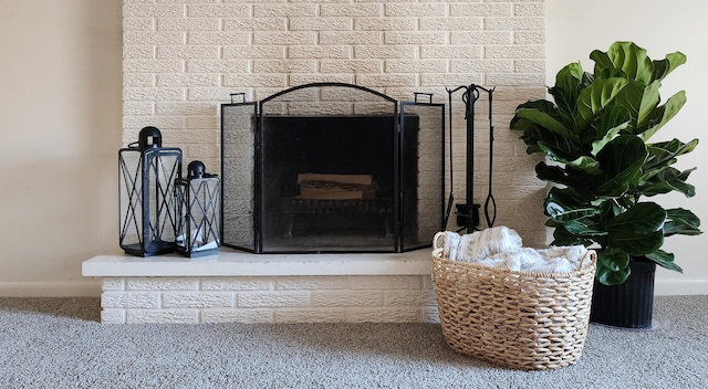 interior details with carpet flooring and a fireplace