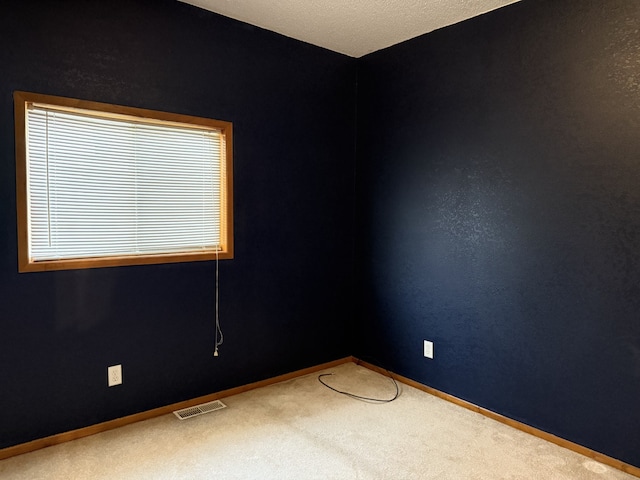 unfurnished room with carpet