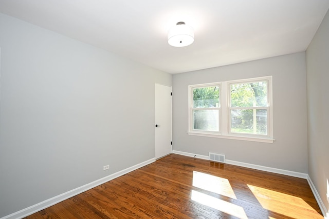 empty room featuring wood-type flooring