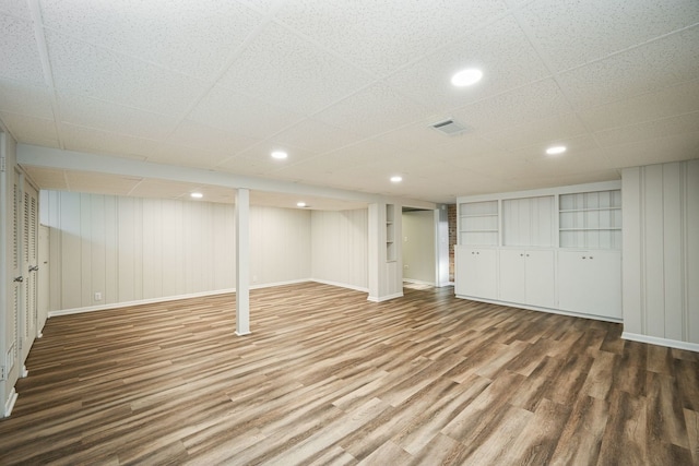 basement with wood-type flooring