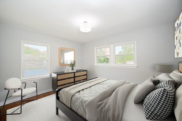 bedroom with light hardwood / wood-style flooring