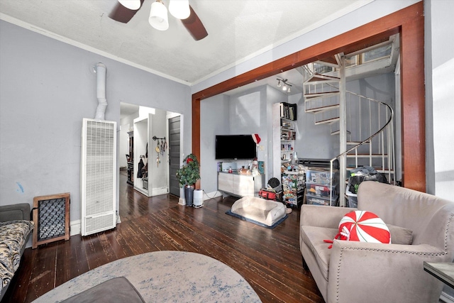 living room featuring ceiling fan, dark hardwood / wood-style flooring, and ornamental molding