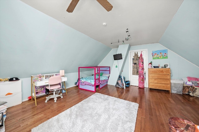 bedroom with ceiling fan, dark hardwood / wood-style floors, and vaulted ceiling