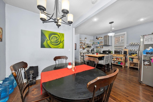 dining area featuring beamed ceiling, dark hardwood / wood-style flooring, and an inviting chandelier