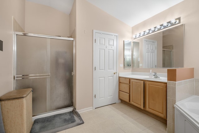 bathroom featuring vanity, lofted ceiling, and shower with separate bathtub