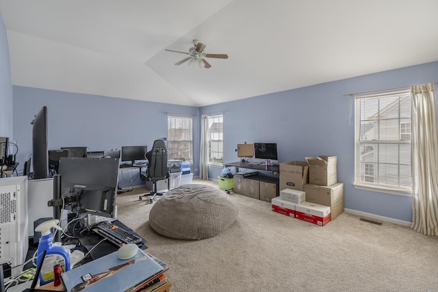 carpeted office with ceiling fan and lofted ceiling