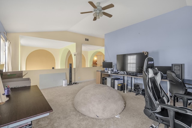 office area featuring carpet, ceiling fan, and vaulted ceiling