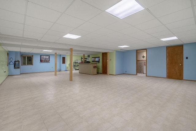 basement featuring a paneled ceiling