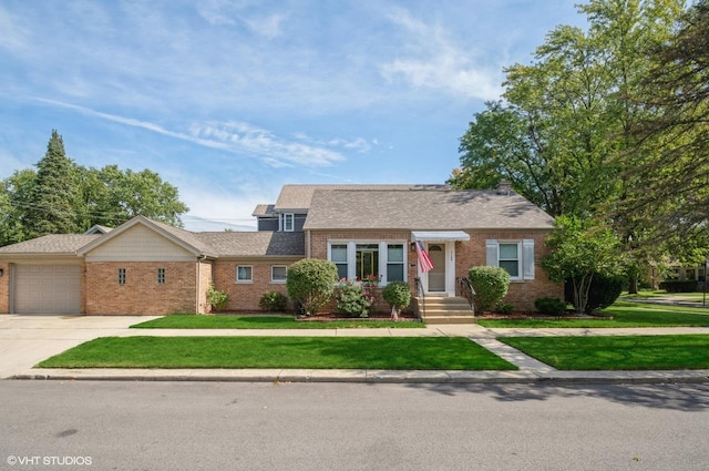 view of front facade with a front yard and a garage